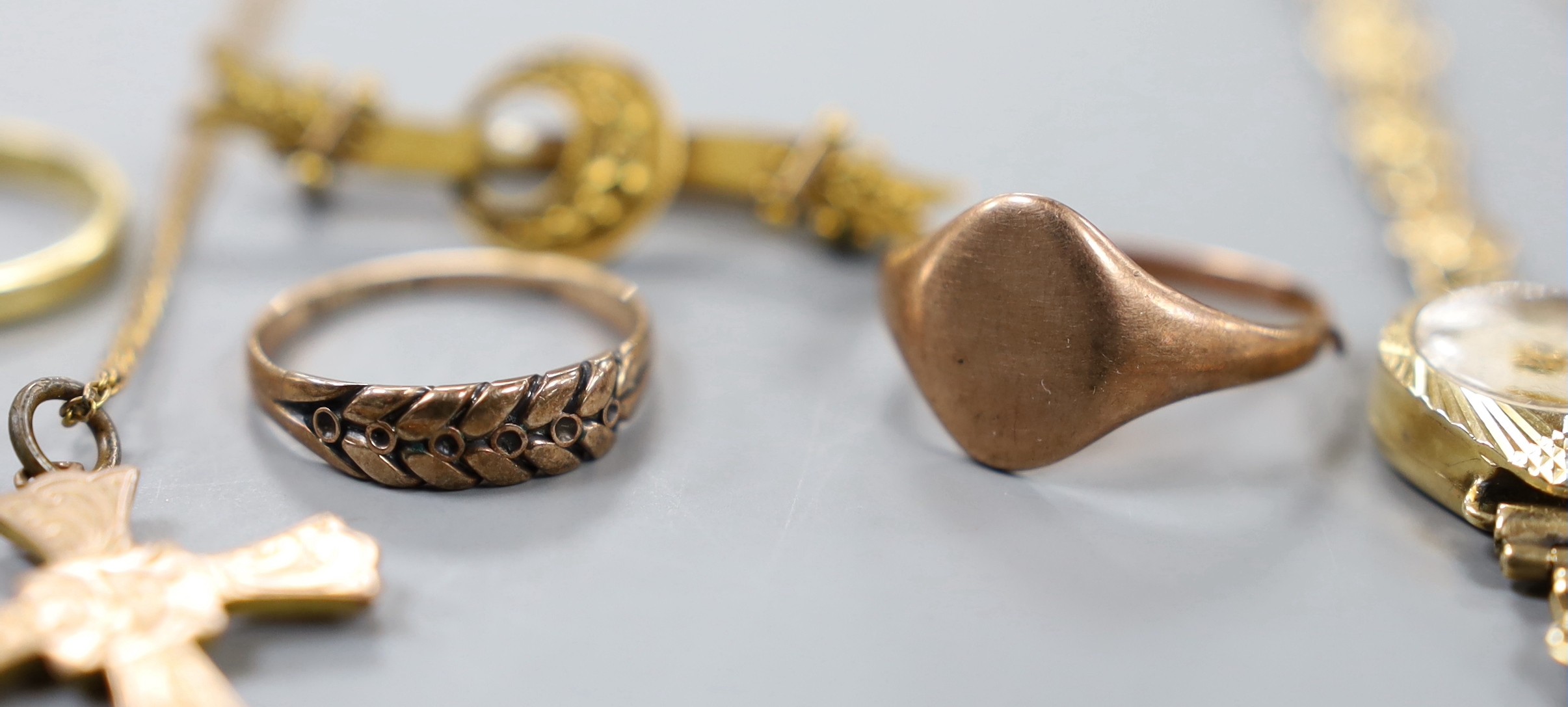 A lady's 9ct gold Accurist manual wind wrist watch, on a 9ct gold bracelet, gross weight 11.2 grams, one other lady's yellow metal wrist watch, three 9ct gold rings, a 9ct gold bracelet, a 9ct cross pendant on 9ct chain,